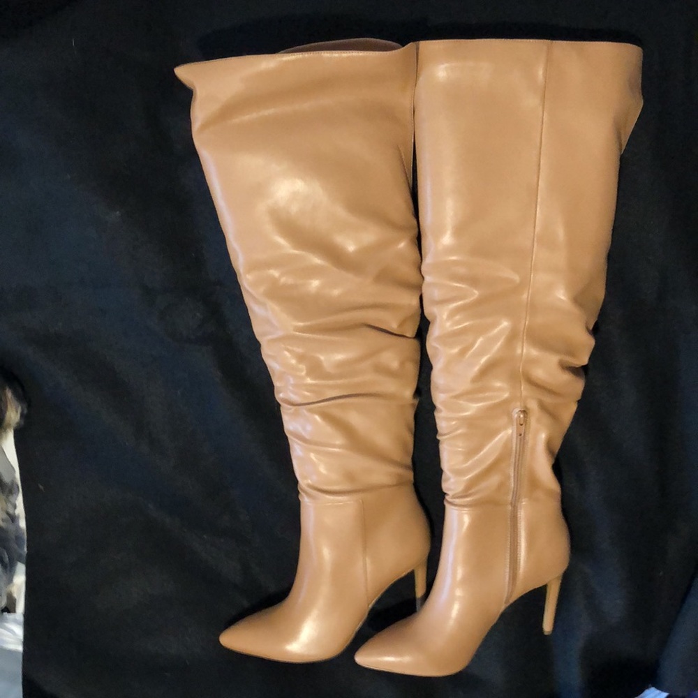 New in box - Over the knee boots in a Carmel color. Never been worn!